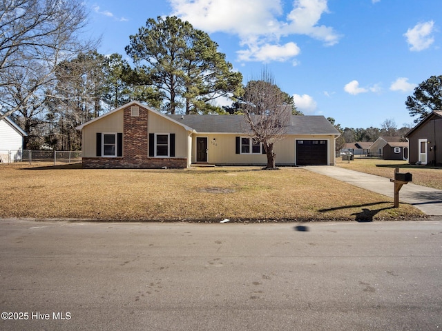 ranch-style home with a garage and a front lawn