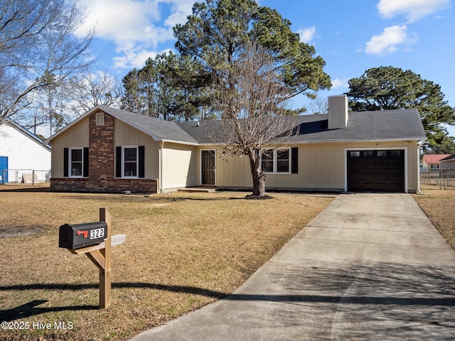 ranch-style home featuring a garage and a front lawn