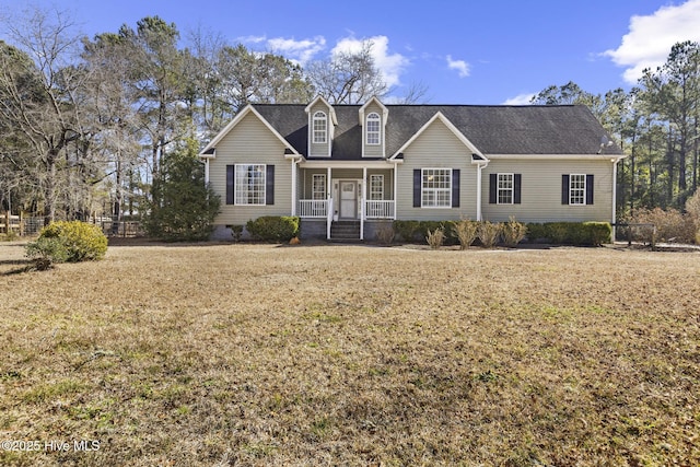 151 Meeks Creek Dr, Rocky Point, NC 28457 - view of front facade with a porch and a front lawn