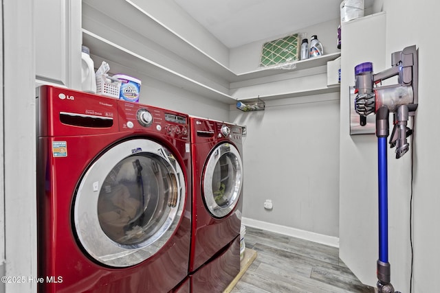 laundry area featuring hardwood / wood-style flooring and separate washer and dryer