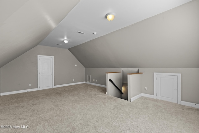 bonus room featuring carpet and lofted ceiling