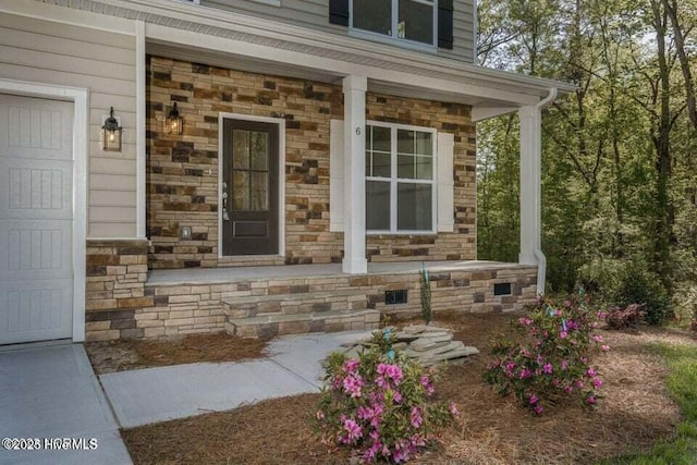 entrance to property with covered porch