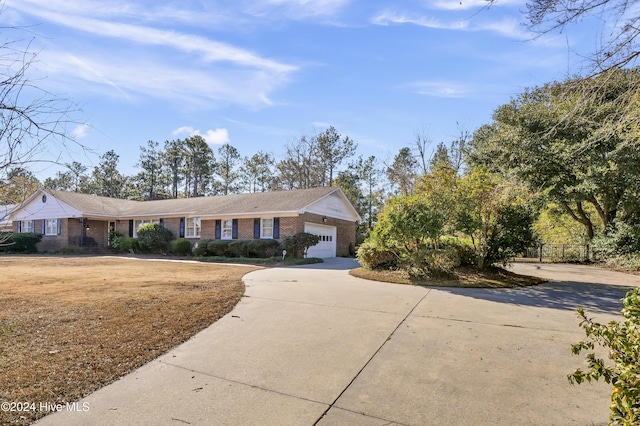 ranch-style house featuring a garage