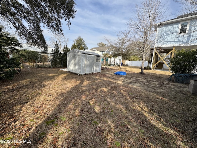 view of yard featuring a storage unit