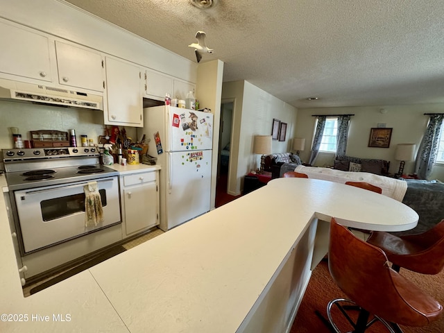 kitchen featuring white cabinetry, white appliances, and a textured ceiling