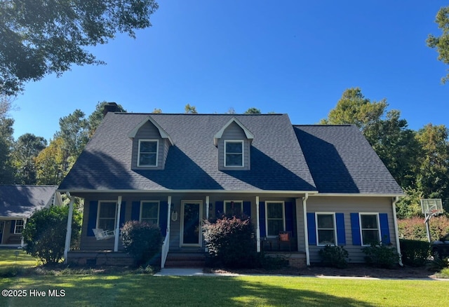 cape cod house with a porch and a front lawn