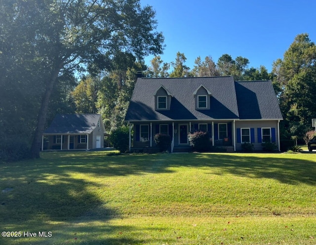 new england style home featuring a front yard