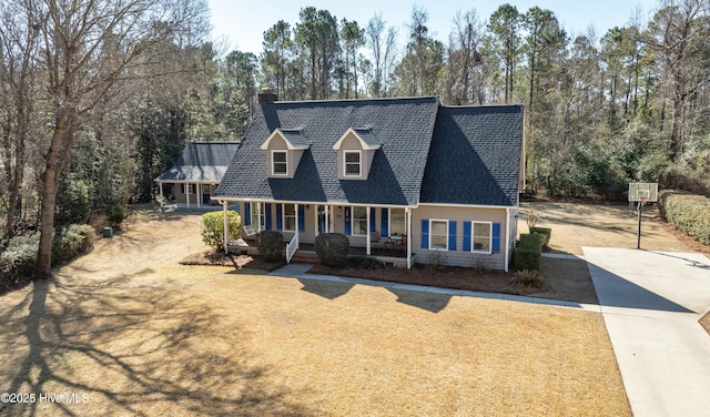 new england style home featuring covered porch