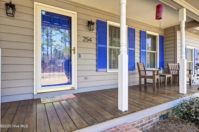 wooden deck featuring covered porch