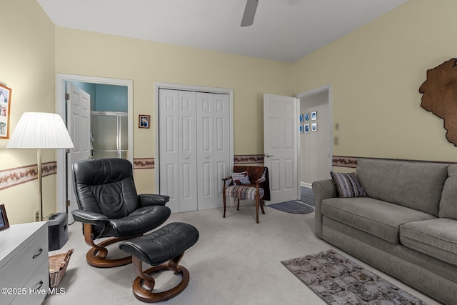 living room with light carpet and ceiling fan