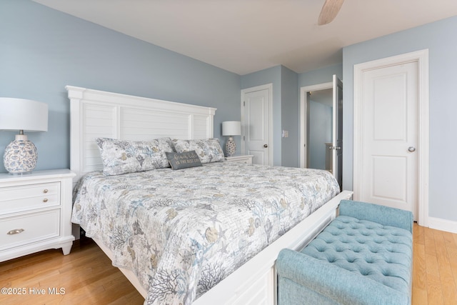 bedroom with light hardwood / wood-style flooring and ceiling fan