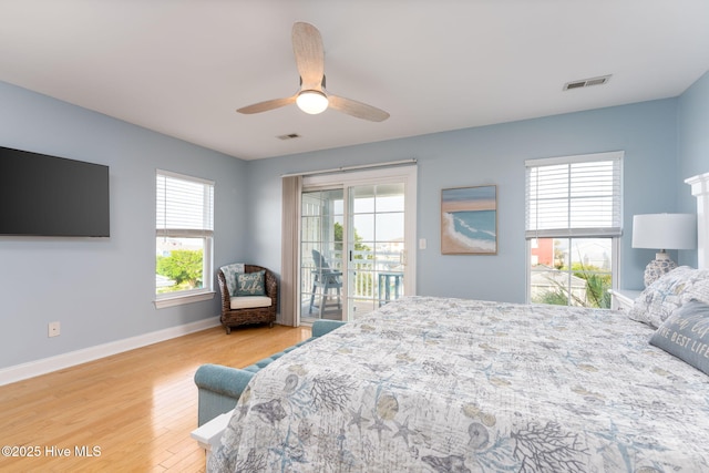 bedroom featuring wood-type flooring, access to exterior, and ceiling fan