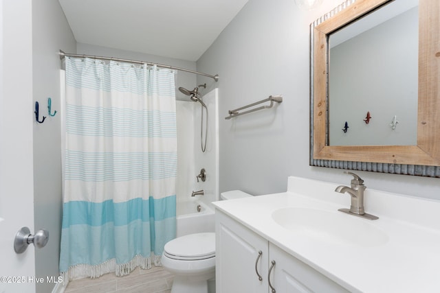 full bathroom featuring toilet, vanity, and shower / bath combo with shower curtain