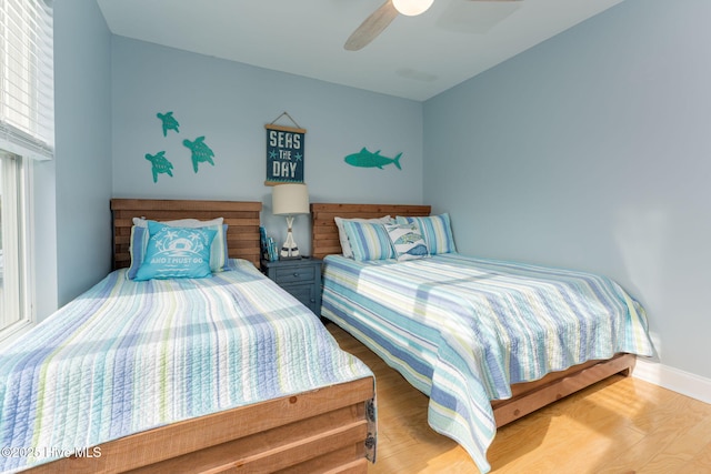 bedroom featuring wood-type flooring and ceiling fan