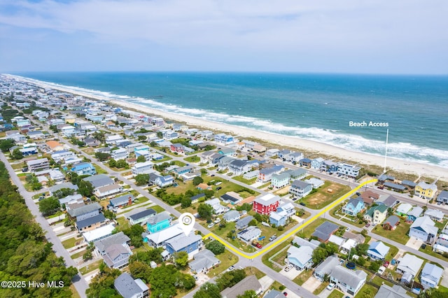 birds eye view of property with a view of the beach and a water view