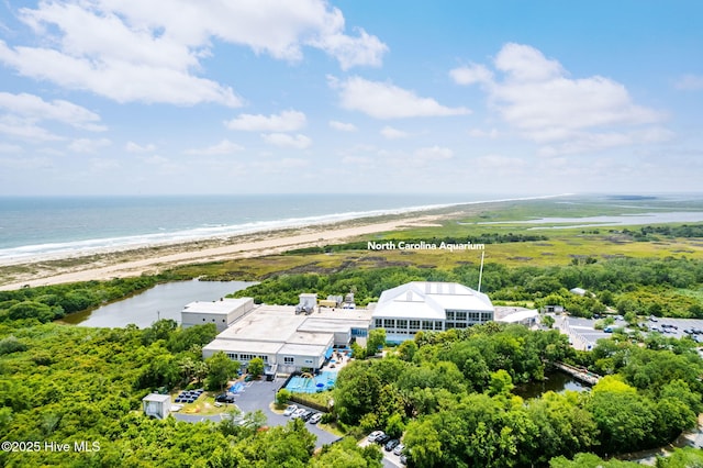 birds eye view of property featuring a water view and a view of the beach