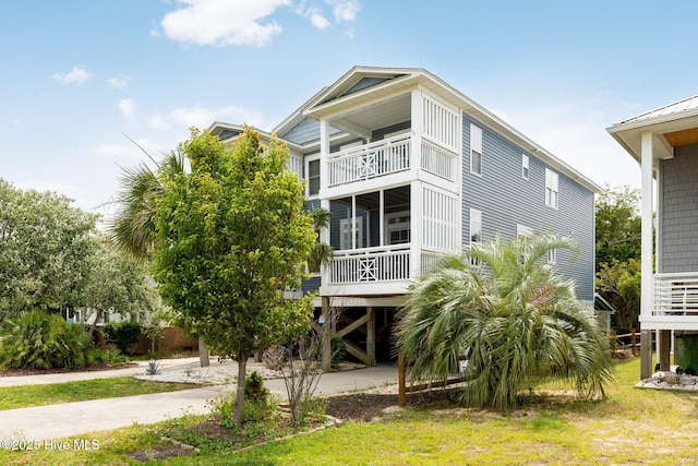 rear view of property with a lawn