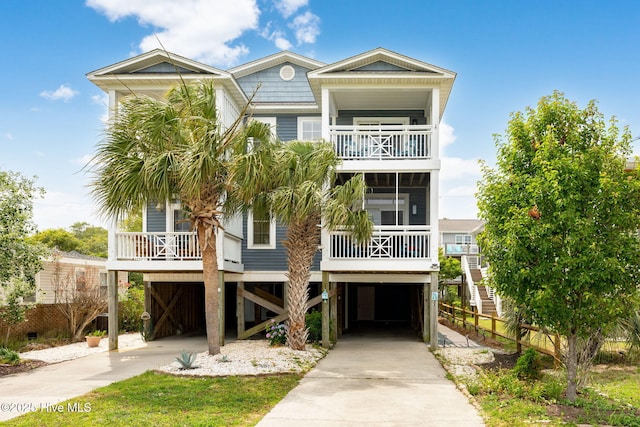 coastal inspired home with a carport and a balcony