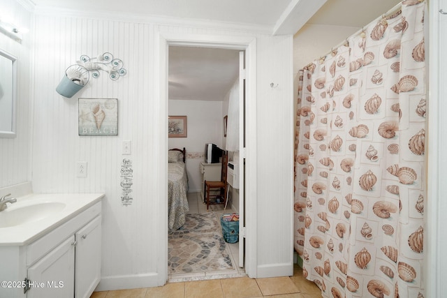 bathroom featuring tile patterned flooring, vanity, and a shower with curtain