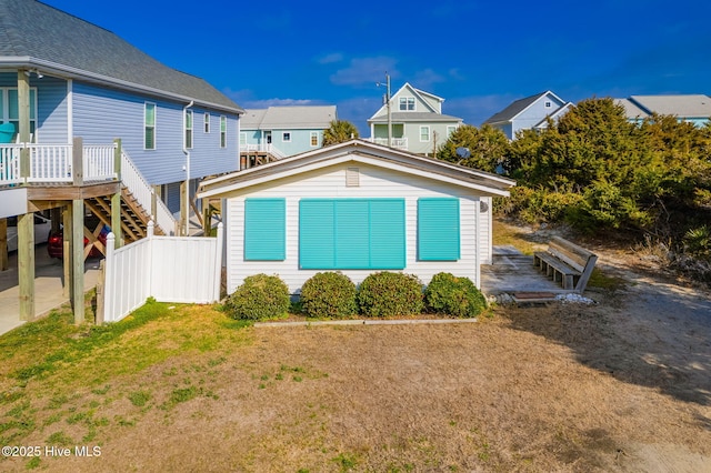 rear view of property with a lawn