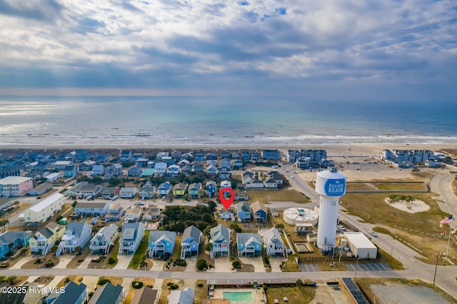 aerial view with a water view and a view of the beach