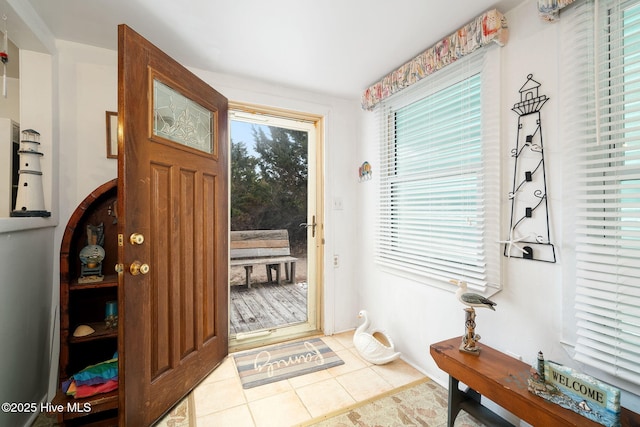 entrance foyer featuring light tile patterned floors