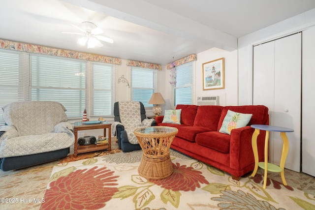 living room with ceiling fan and beam ceiling