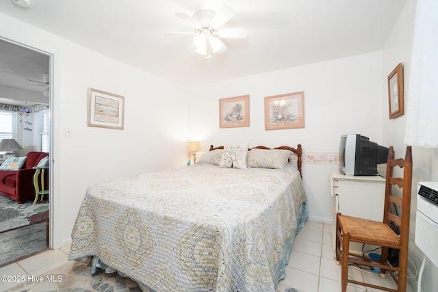 tiled bedroom with ceiling fan