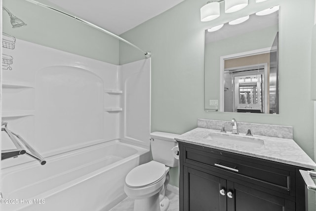 full bathroom featuring toilet, vanity, and bathtub / shower combination