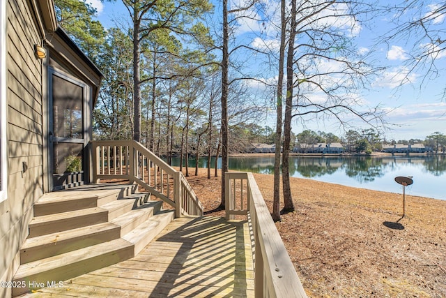 wooden deck featuring a water view