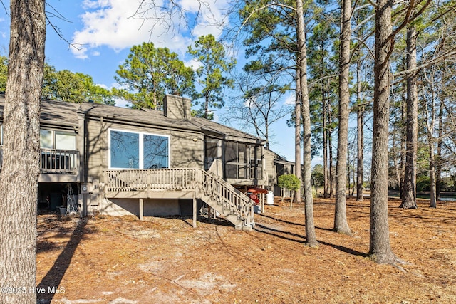 rear view of house with a deck