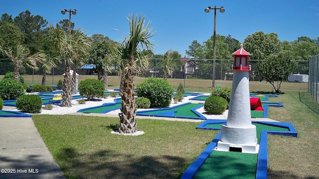 view of property's community featuring a yard