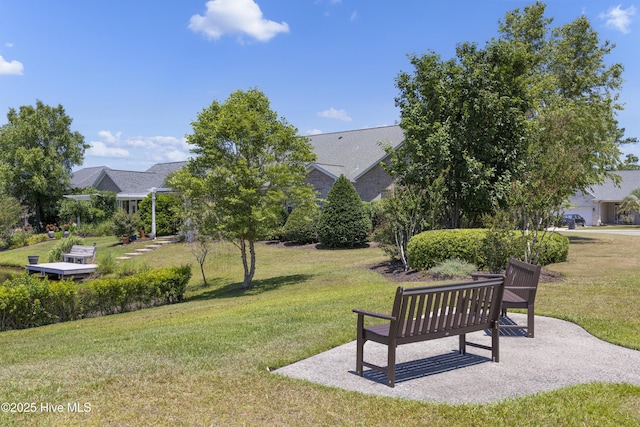 view of property's community with a yard