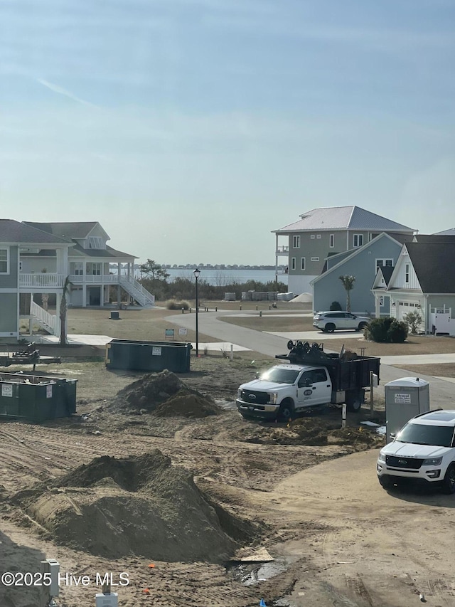 view of parking with a residential view