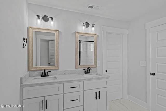 full bathroom with marble finish floor, visible vents, a sink, and double vanity