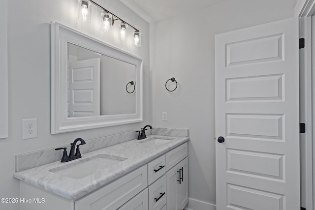 full bath with double vanity and a sink