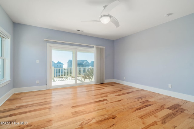 empty room featuring ceiling fan and light wood-type flooring