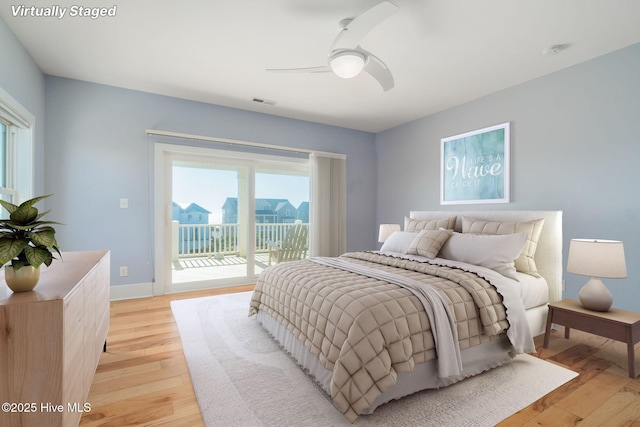 bedroom with access to exterior, ceiling fan, and light wood-type flooring