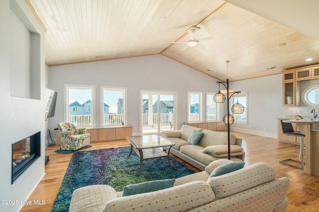 living room featuring vaulted ceiling, ceiling fan, wood ceiling, and light hardwood / wood-style flooring