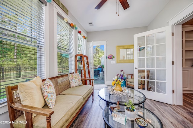 interior space featuring french doors, visible vents, ceiling fan, and wood finished floors