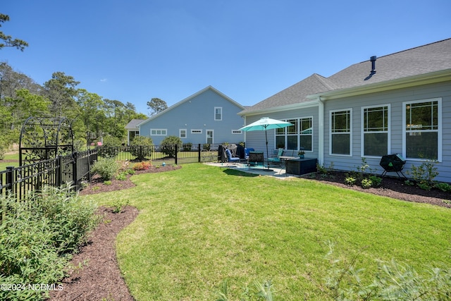 view of yard featuring a patio area and fence