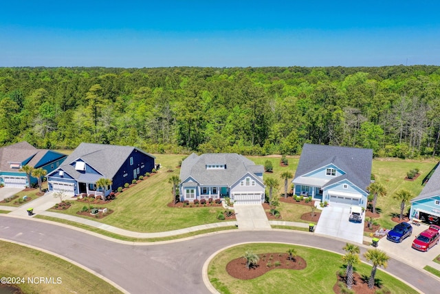 aerial view featuring a wooded view