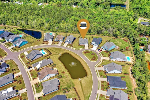 birds eye view of property featuring a residential view and a water view