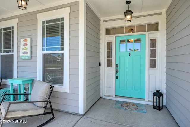 doorway to property featuring a porch