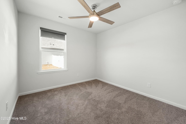 carpeted empty room featuring ceiling fan