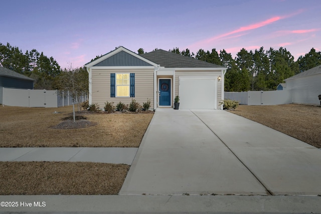 ranch-style house featuring driveway, a garage, a gate, and fence