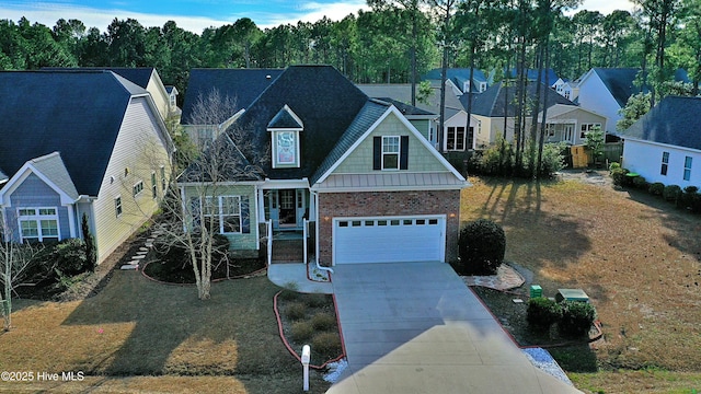 traditional-style house with a garage, concrete driveway, and brick siding