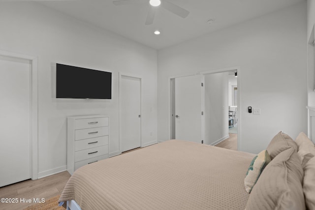 bedroom featuring light hardwood / wood-style flooring and ceiling fan