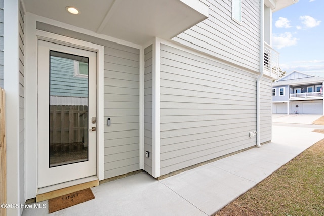 property entrance featuring a patio