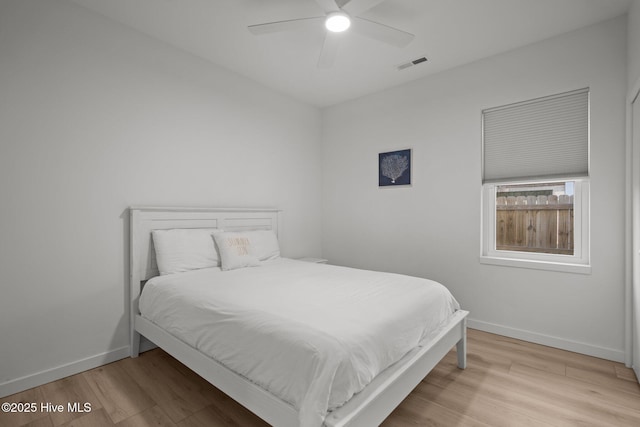 bedroom featuring ceiling fan and light hardwood / wood-style floors